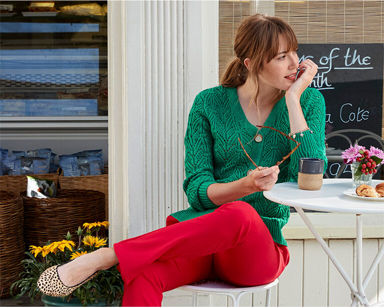 Red trousers with green knitwear