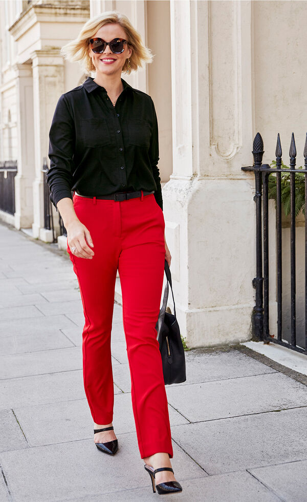 Black blouse and red trousers